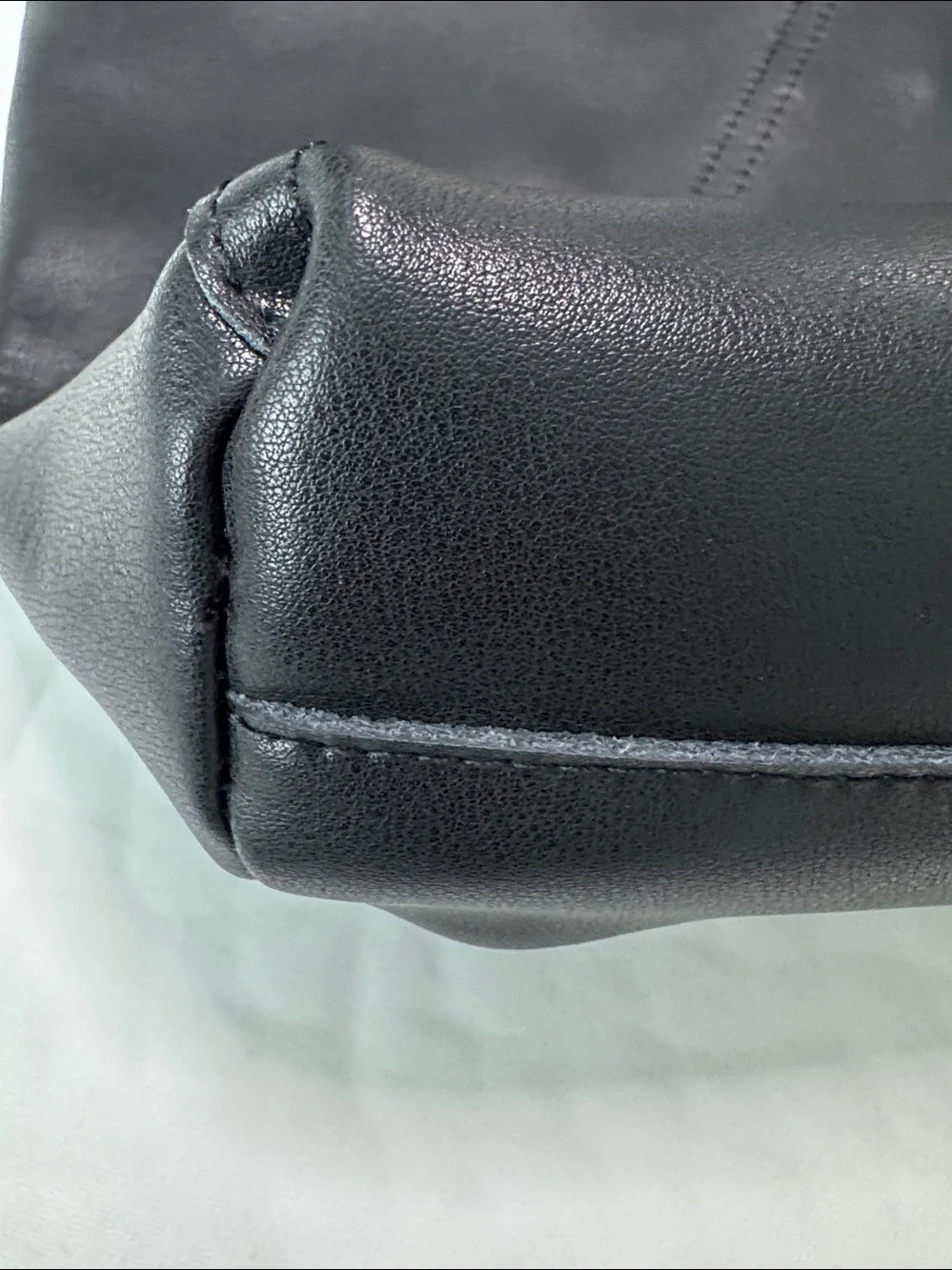 Sleek Black Leather Hobo Bag with Woven Tan Handle